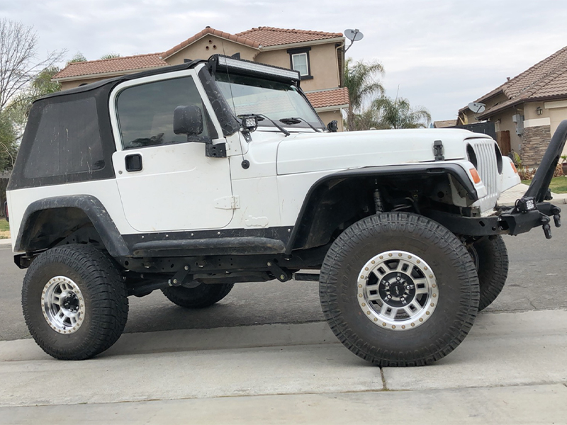 1997 Jeep Wrangler - 15x8 Vision Wheels 33/ ProComp Tires Rough  Country