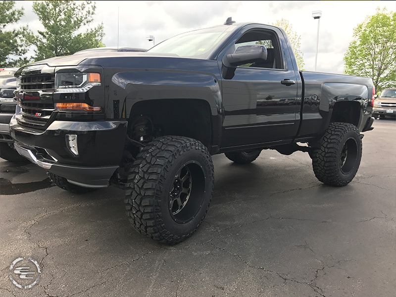 2016 Chevy Silverado 1500 With 9 Inch Mcgaughy Lift Kit Xd Series Kmc Buck 25 Xd825mb 20x12  44 Offset 20 By 12 Inch Wide Wheel Cooper Discoverer Stt Pro 37x13 5r20 Tire 